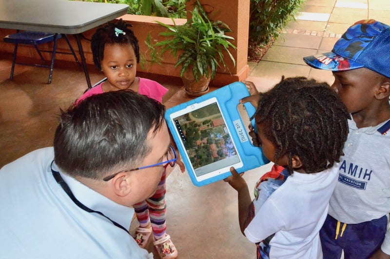 children looking at ipad