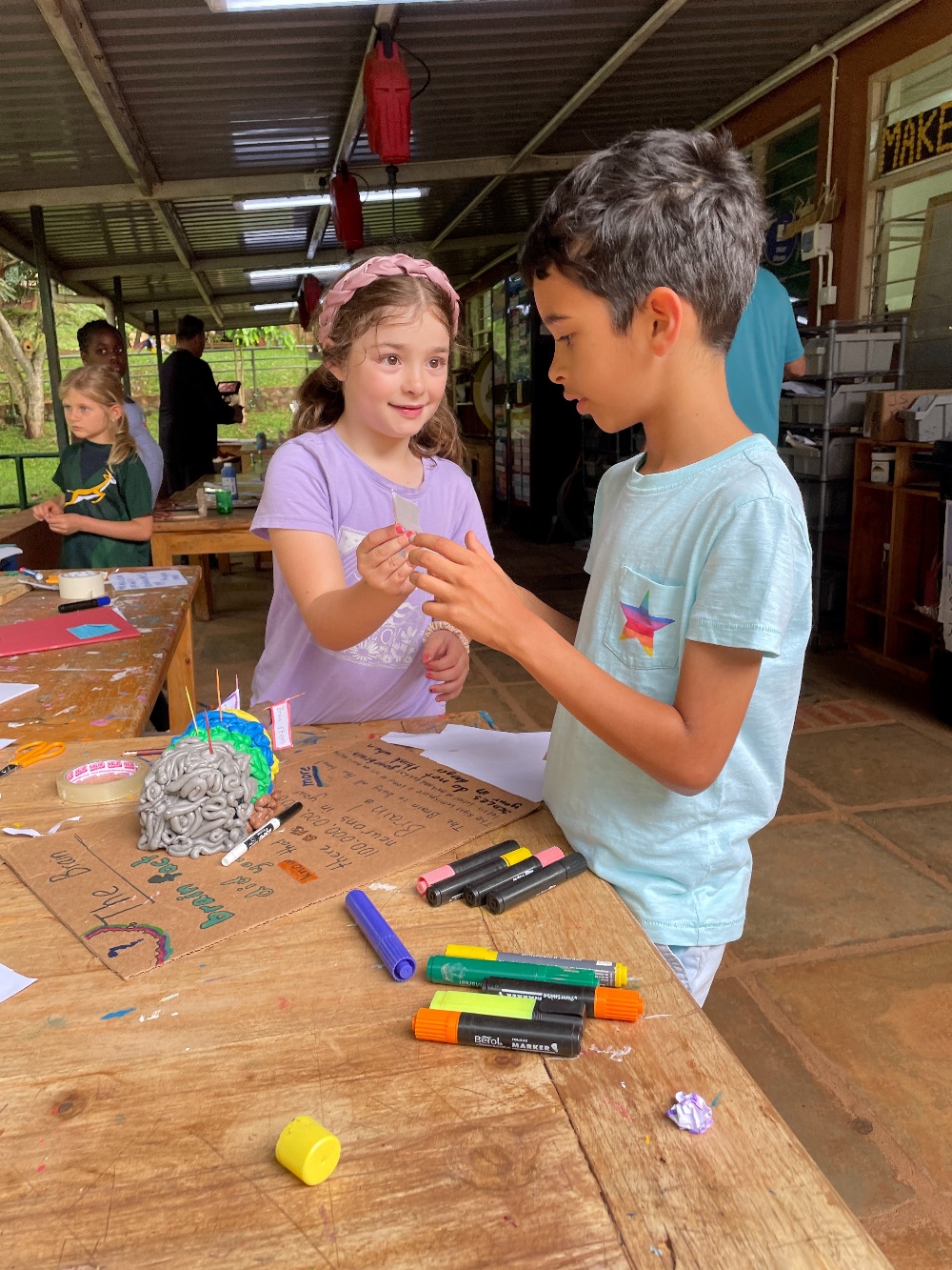 two students engaged in an art project