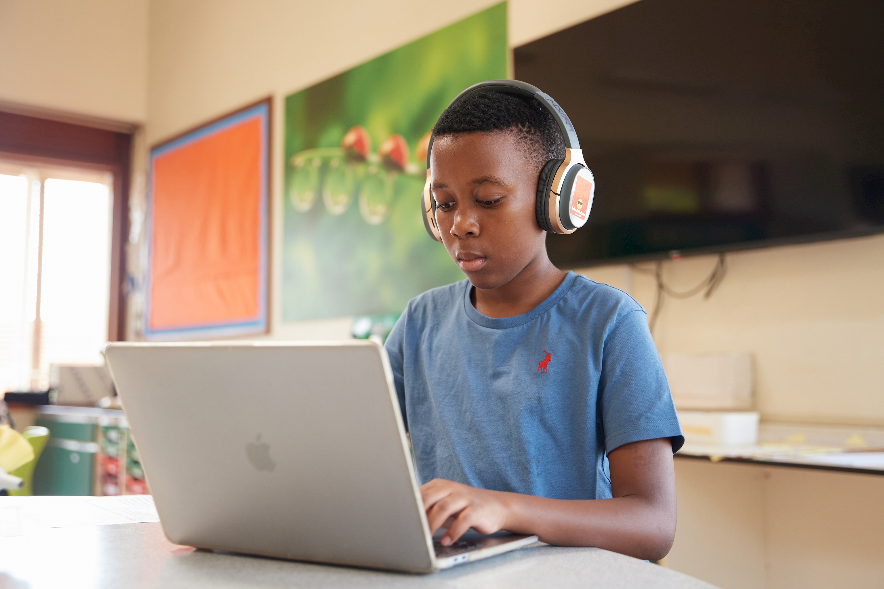 Students working on laptops at the International School of Uganda